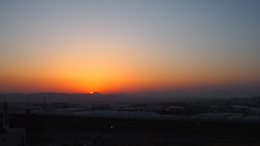 The sun was poking out just beyond the distant hills to the west.