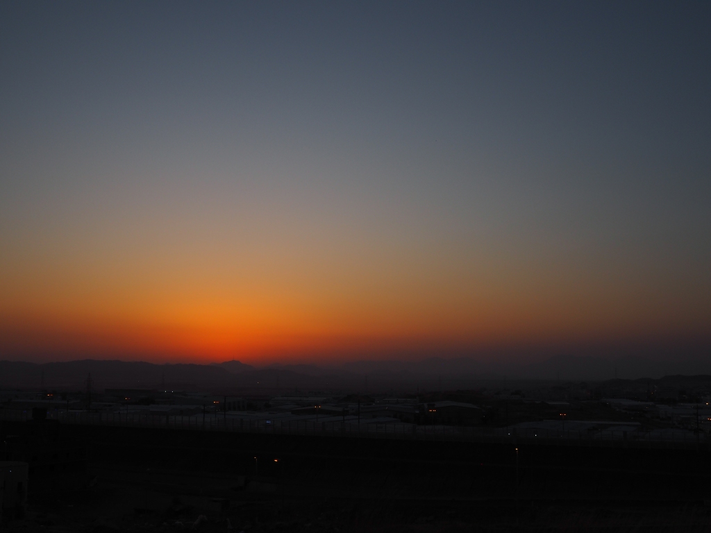 A greenish hue can be seen once the sun lowers just beyond the horizon.