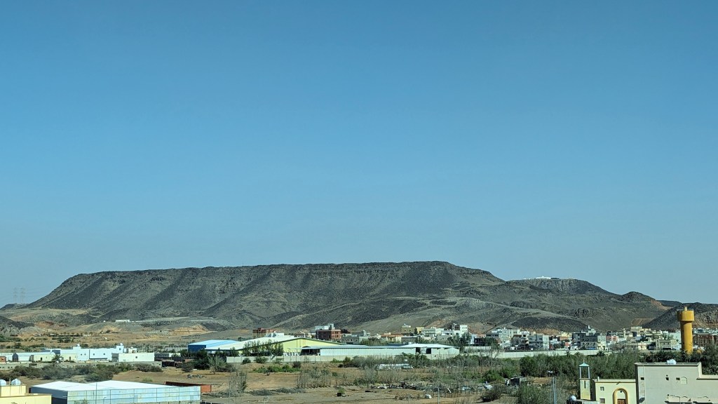 The landscape is fairly rugged - many of the hills are covered in black volcanic pumice.